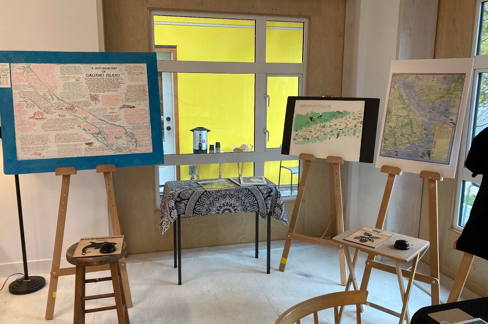 Three illustrated maps are displayed on easels in one corner of the gallery. In front of the maps can be seen
    two species panels with audio buttons.